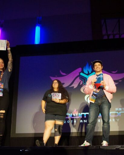 Extra Life representatives on the Youmacon main stage thanking attendees for supporting children’s hospitals